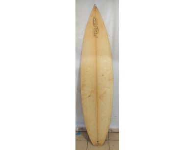 Surfboard featuring a pintail design with cream/pa...