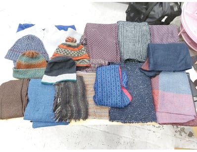 Collection of scarves and wraps in varied textiles...