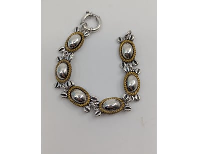 SILVER BRACELET WITH GOLD COLOUR

Length: 18.00c...