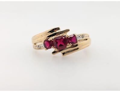 9CT YELLOW GOLD RUBY AND DIAMOND RING


583010+...
