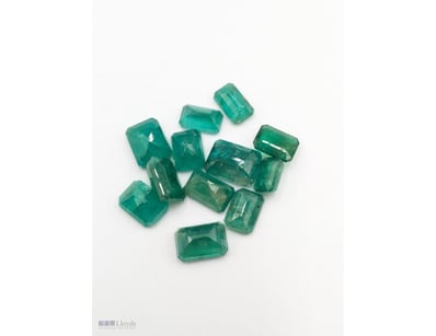 TWELVE EMERALD CUT NATURAL EMERALDS

Total Carat W...