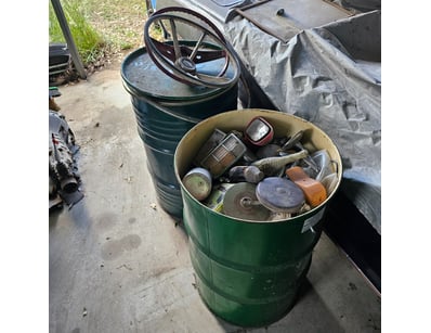 Drum of car parts and equipment, including steerin...