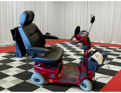 Pride Celebrity Deluxe mobility scooter in burgund...