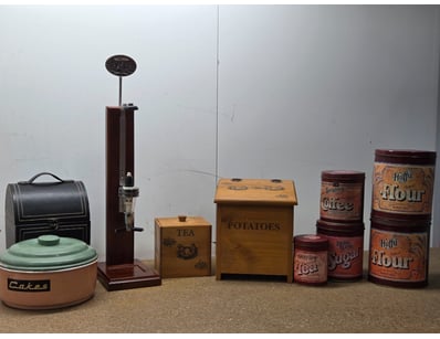 Charming vintage kitchen storage collection featur...