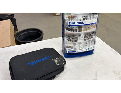 Dremel and accessories with case.

