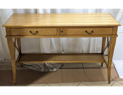 Elegant oak console table featuring two spacious d...