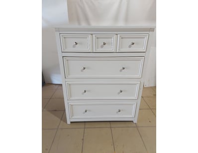 White painted timber chest of drawers featuring a ...