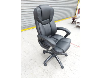 Office chair featuring black PU leather upholstery...