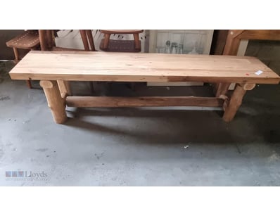 Rustic solid wood bench featuring a light natural ...