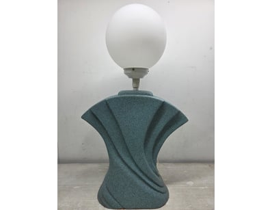Contemporary table lamp featuring a sculptural tea...