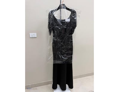 BLACK LACE EVENING GOWN WITH FLUTTER SLEEVES

Item...