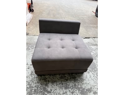 Modern upholstered ottoman/chair featuring a two-t...