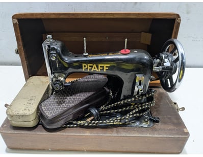 Vintage Pfaff sewing machine in original wooden ca...