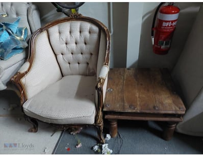 Elegant vintage armchair and side table set featur...