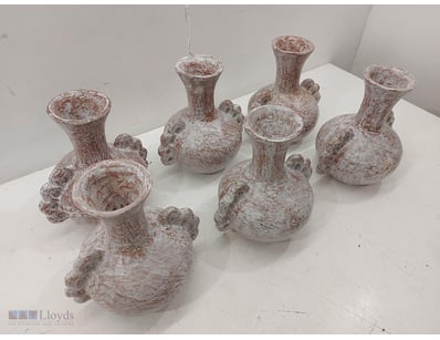 A collection of Six decorative ceramic pots featur...