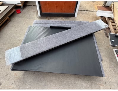 Double bed base featuring a grey linen-style fabri...