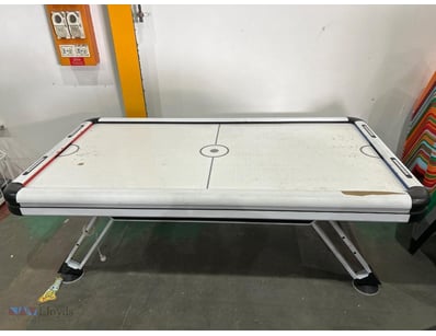 Air hockey table featuring a sleek black and white...
