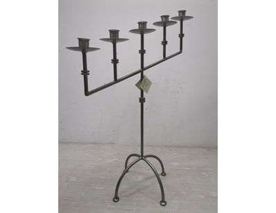 Industrial-style wrought iron style candelabra fea...
