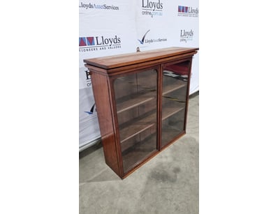 Antique timber display cabinet featuring two glaze...