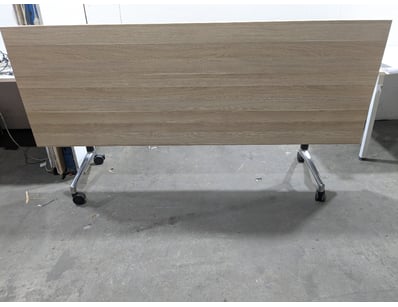 Mobile flip-top training table featuring a light o...