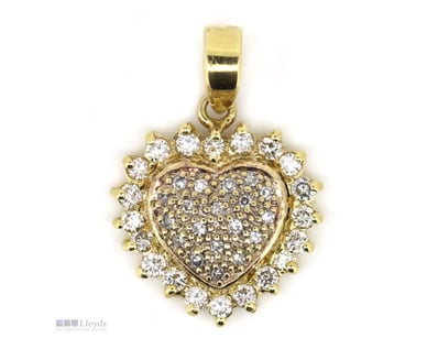 18K YELLOW GOLD AND DIAMOND, HEART PENDANT.      
...