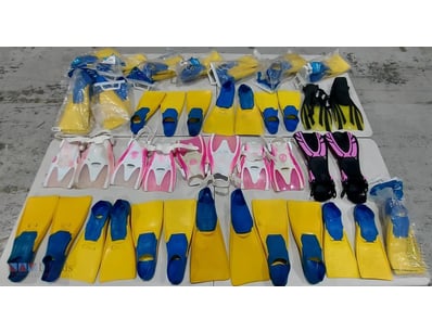 Assorted pairs of fins in various kids sizes and c...