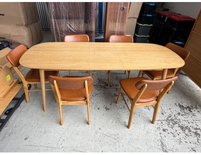 Mid-century modern dining suite featuring an exten...