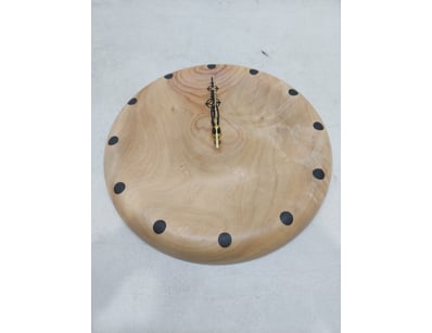 Handcrafted wooden wall clock featuring a light ti...