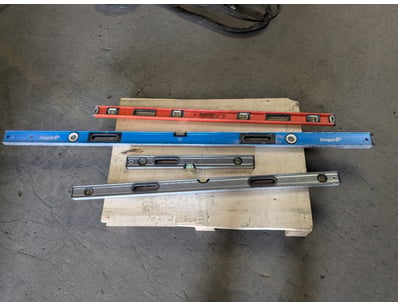 Collection of four spirit levels in varying sizes ...