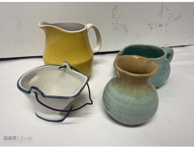 COLLECTION OF FOUR VINTAGE CERAMIC PITCHERS AND CO...