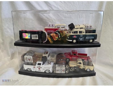Two-tier acrylic display case featuring a curated ...