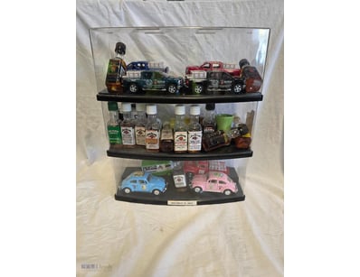 Three display cases featuring Jim Beam bourbon whi...