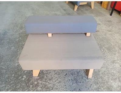 Modern upholstered bench featuring a two-tone desi...