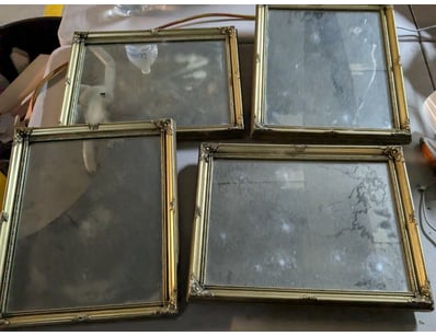 Collection of six ornate brass-framed picture fram...