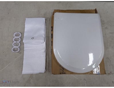 White toilet seat with soft-close lid mechanism. I...