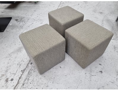 Set of three upholstered cube ottomans in neutral ...