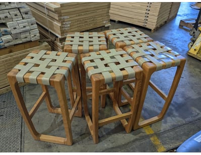 Set of five wooden bar stools featuring solid timb...