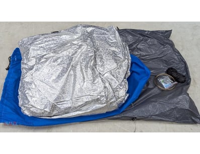 Compact emergency shelter system comprising reflec...