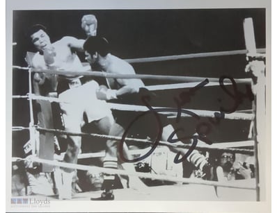 PHOTOGRAPH SHOWING A BOXING MATCH BETWEEN MUHAMMAD...