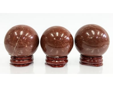 RED JASPER SPHERE WITH WOODEN STAND, QTY 3

Dime...
