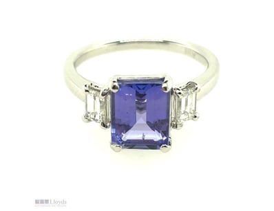 18CT WHITE GOLD TANZANITE AND DIAMOND RING

Featur...