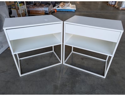 Pair of bedside tables featuring clean-lined desig...