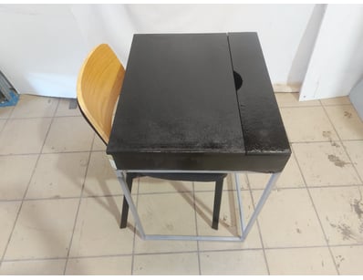 Table with black top and metal frame base in grey....