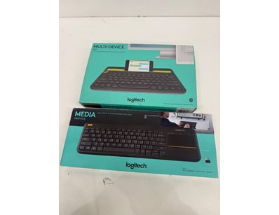 Lot includes two Logitech wireless keyboards. Medi...