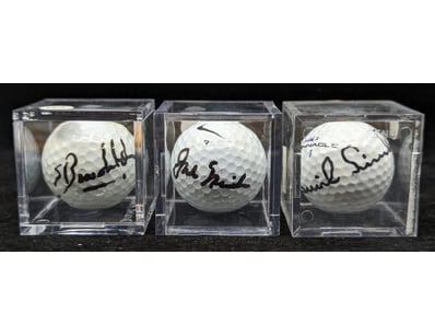 THREE SIGNED GOLF BALLS

Golf Balls In Plastic D...