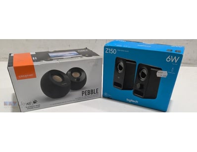 Lot includes two desktop speaker systems. Creative...