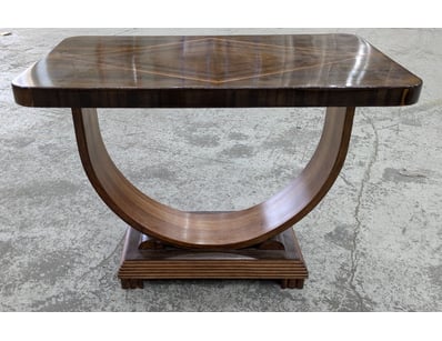 Art Deco console table featuring a striking geomet...