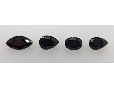 17.72 TCW BLACK STONES

Four Stones With Various...