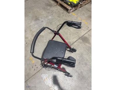Red and black four-wheeled walker with padded blac...