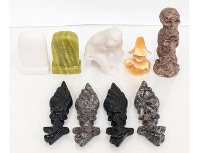 COLLECTION OF NINE CARVED CRYSTAL FIGURATIVE SCULP...